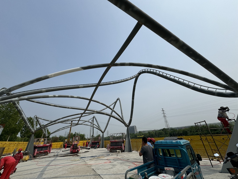 Complex curved tubular steel frame during installation